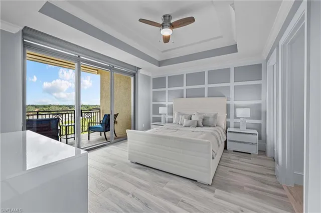 a bedroom with a bed and glass walk in closet