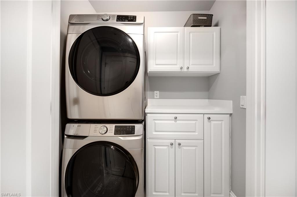9115 Strada Place, Unit 5511 Naples, FL 34108 - Photo 20 of 38 a close view of a utility room with dryer and washer