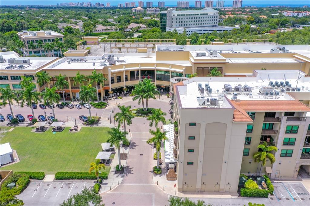 9115 Strada Place, Unit 5511 Naples, FL 34108 - Photo 23 of 38 a view of a city and a large building