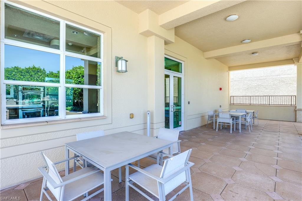 9115 Strada Place, Unit 5511 Naples, FL 34108 - Photo 33 of 38 a view of a dining room with furniture and window