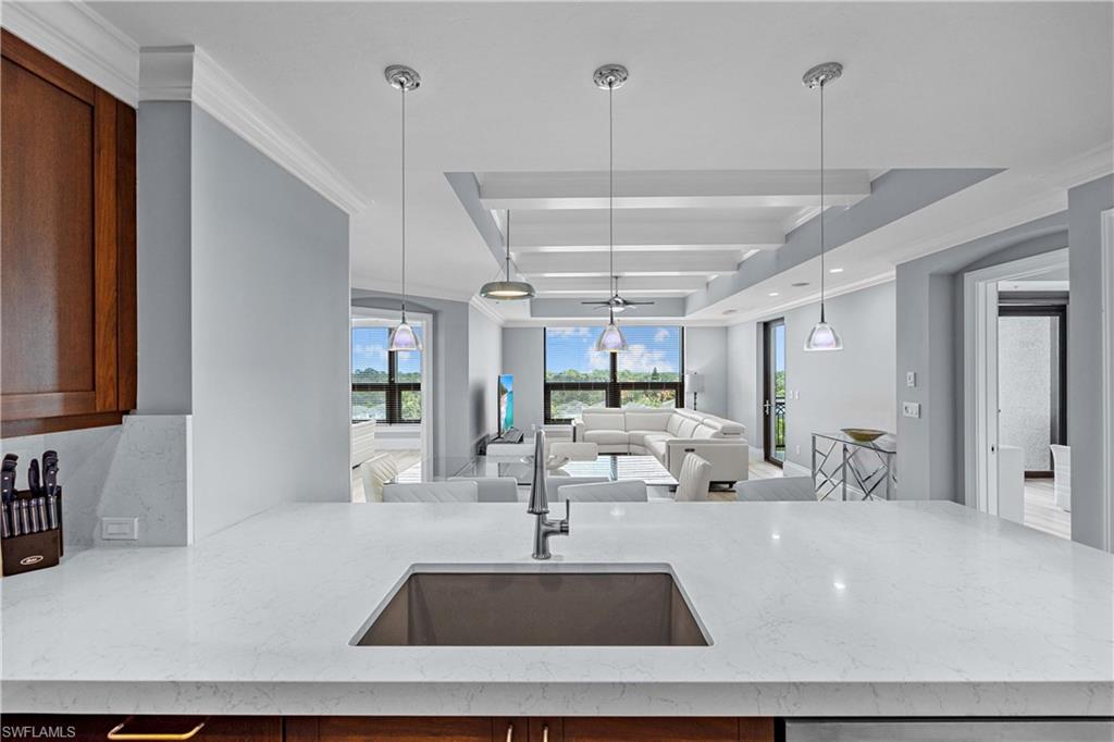 9115 Strada Place, Unit 5511 Naples, FL 34108 - Photo 9 of 38 a view of a living room and chandelier