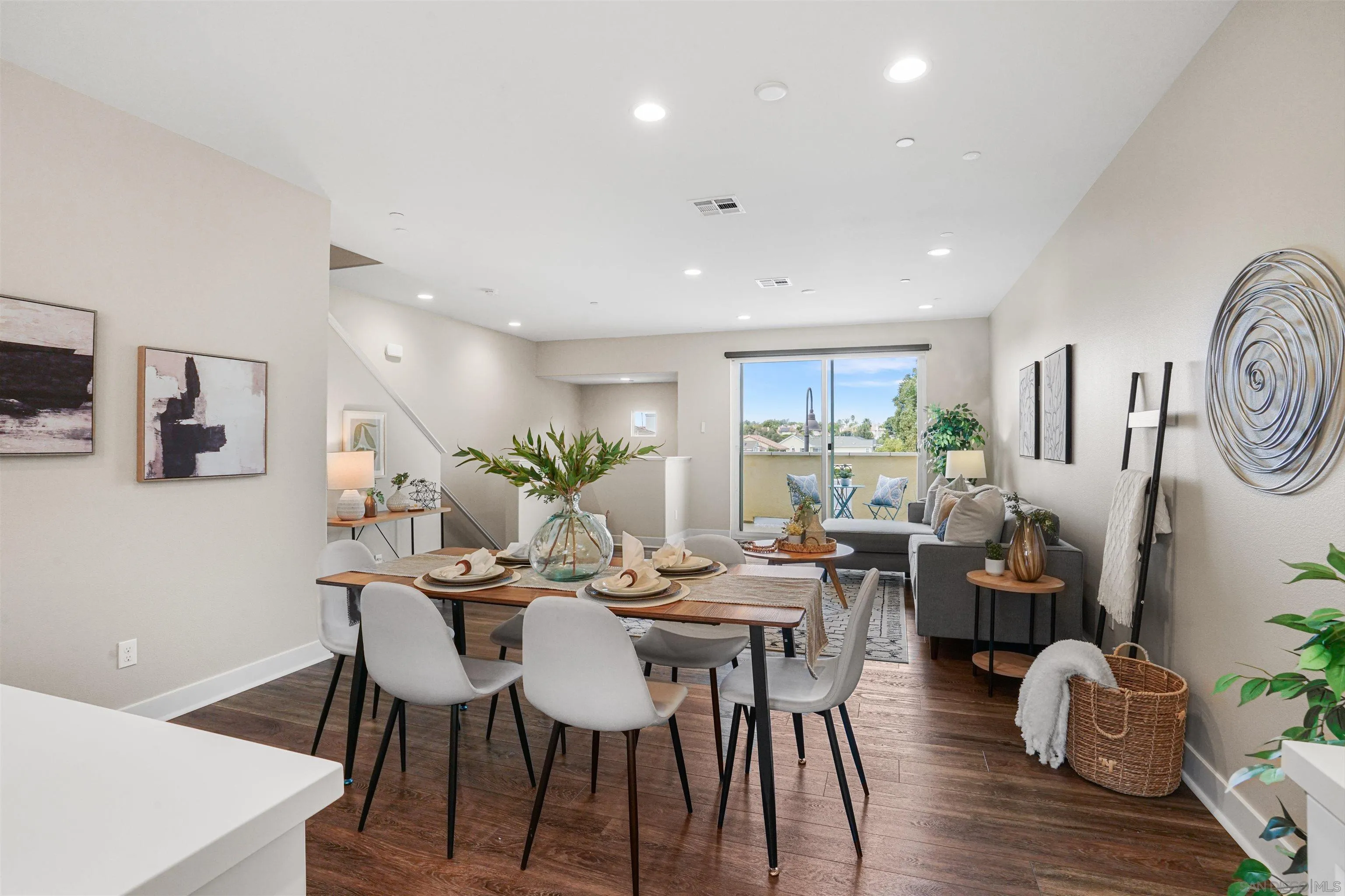 4348 Nautilus Way, Unit 4 Oceanside, CA 92056 - Photo 11 of 34 a view of a dining room with furniture window and wooden floor