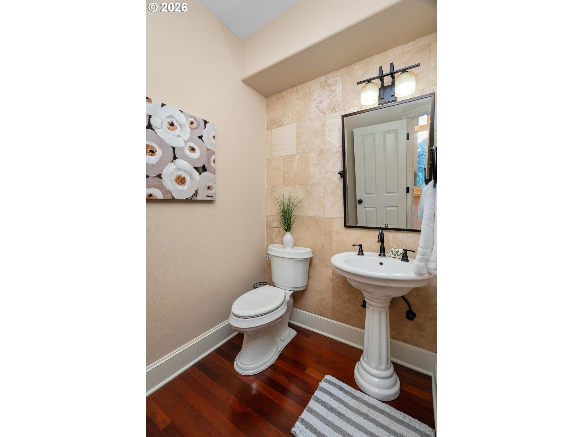 12352 Northwest Hibbard Drive Portland, OR 97229 - Photo 19 of 48 a bathroom with a sink toilet and a mirror