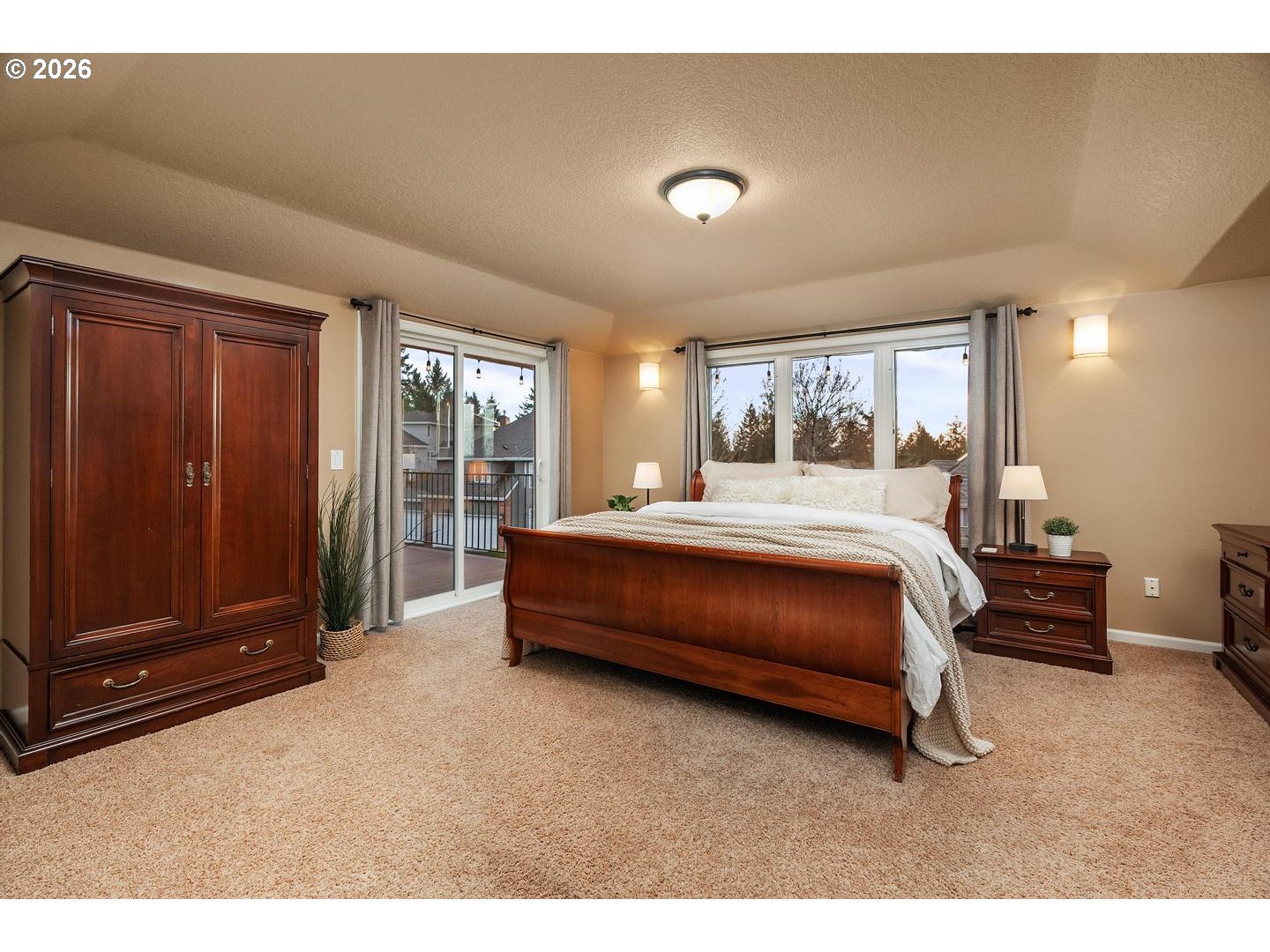 12352 Northwest Hibbard Drive Portland, OR 97229 - Photo 25 of 48 a bedroom with a bed and large window