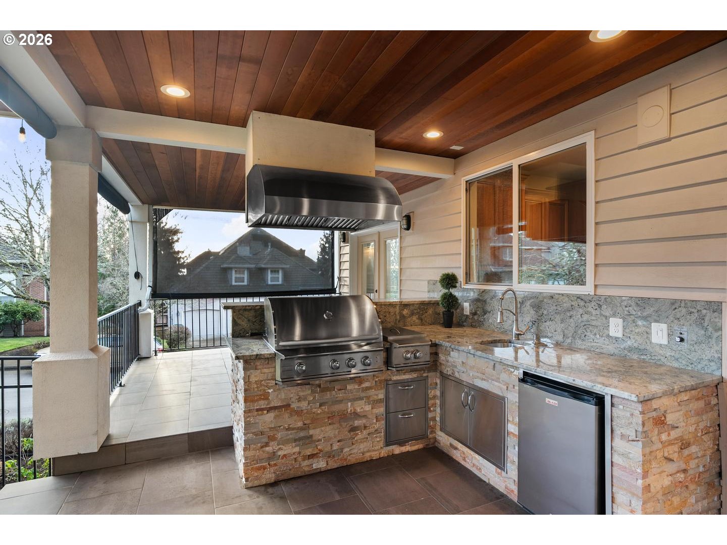 12352 Northwest Hibbard Drive Portland, OR 97229 - Photo 43 of 48 a kitchen with stainless steel appliances kitchen island granite countertop a sink and cabinets