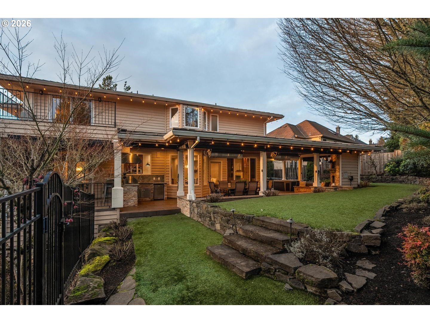 12352 Northwest Hibbard Drive Portland, OR 97229 - Photo 45 of 48 a view of a big house with a big yard potted plants and large tree