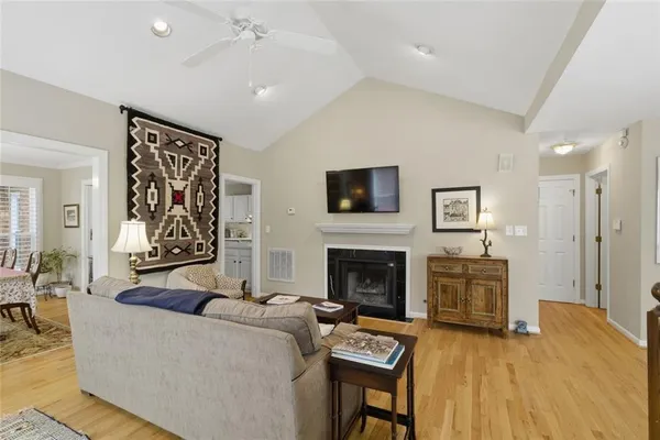 a living room with furniture and a fireplace