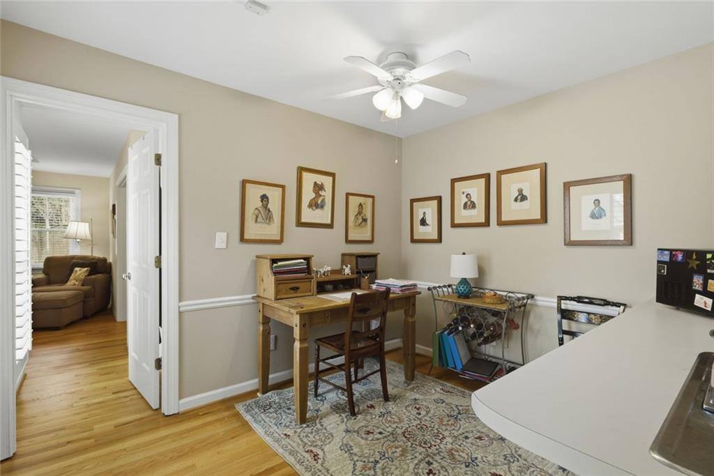 3269 Embry Downs Court Atlanta, GA 30340 - Photo 20 of 38 a view of a workspace with furniture and wooden floor