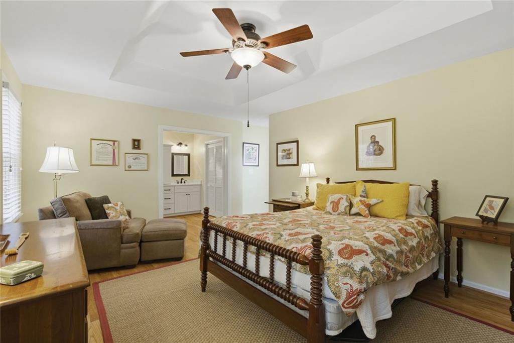 3269 Embry Downs Court Atlanta, GA 30340 - Photo 23 of 38 a bedroom with a bed couch and a window