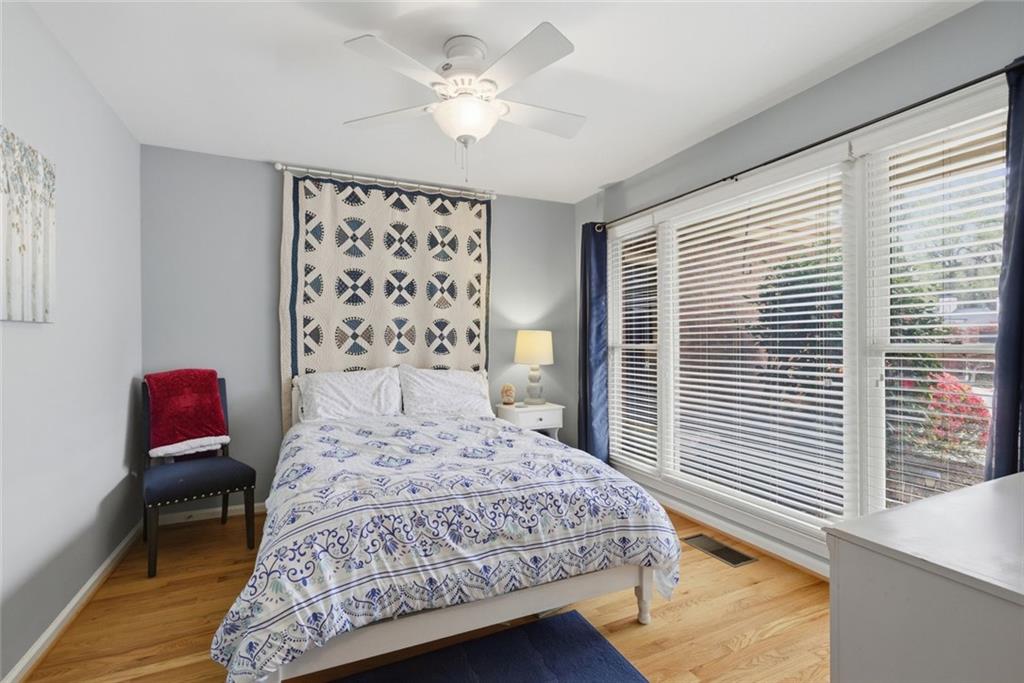 3269 Embry Downs Court Atlanta, GA 30340 - Photo 26 of 38 a bedroom with a bed dresser and a window