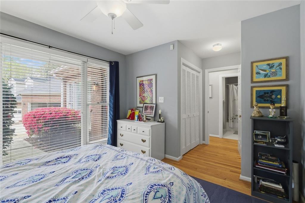3269 Embry Downs Court Atlanta, GA 30340 - Photo 27 of 38 a bedroom with a bed and a dresser in it