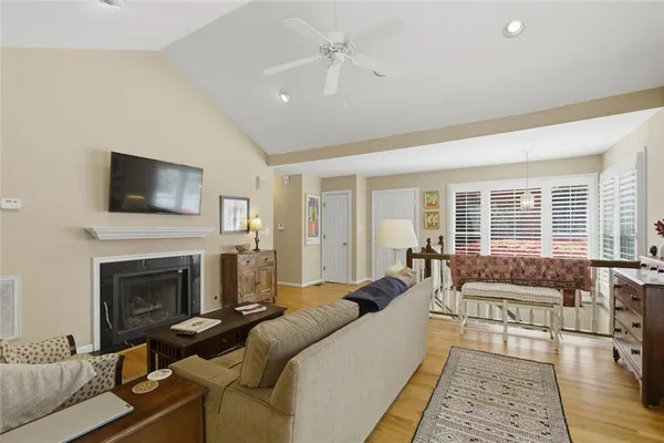 a living room with furniture fireplace and flat screen tv