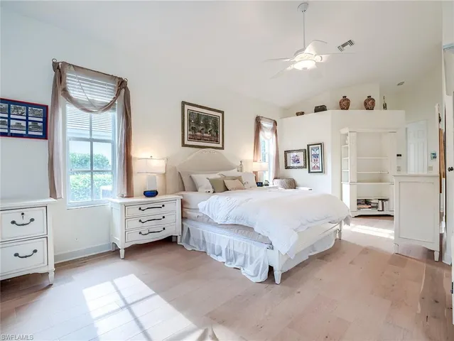 a spacious bedroom with a bed and closet