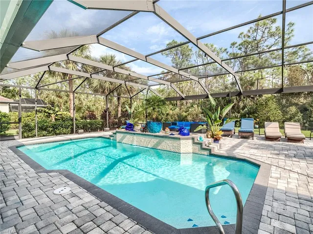 a view of a swimming pool with a patio