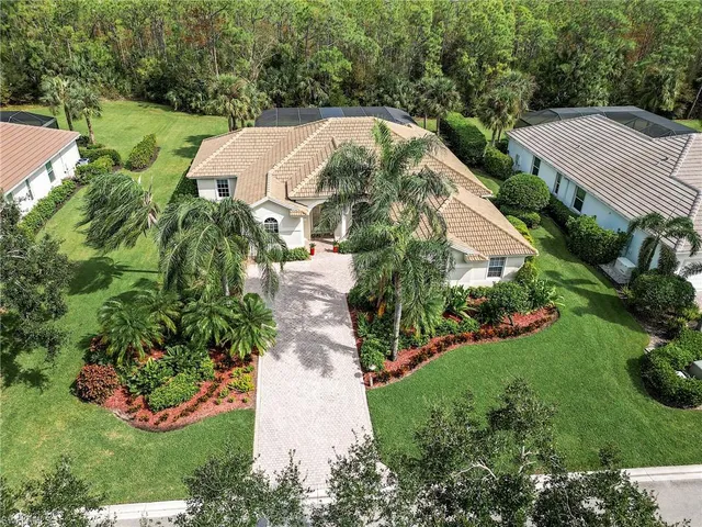 an aerial view of a house with a ocean view