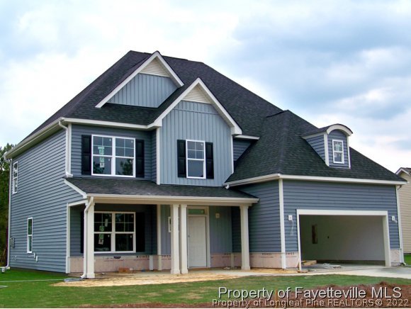 101 Caulfield Road Aberdeen, NC 28315 - Photo 1 of 19 a front view of a house with a garden