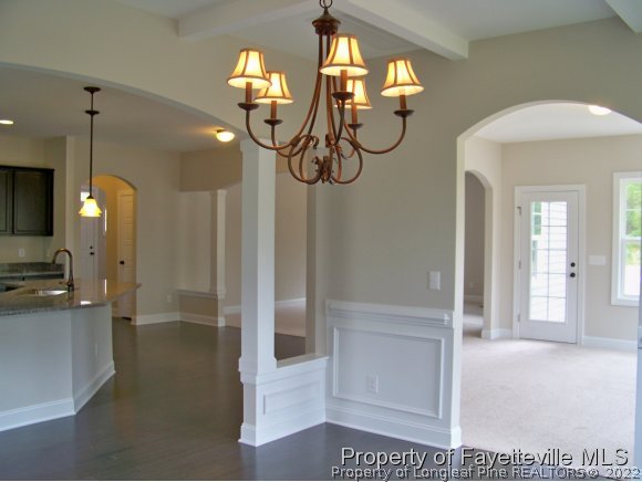 101 Caulfield Road Aberdeen, NC 28315 - Photo 2 of 19 a view of a hallway with chandelier