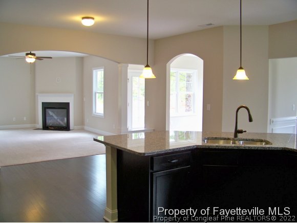 101 Caulfield Road Aberdeen, NC 28315 - Photo 4 of 19 a kitchen with stainless steel appliances a sink a counter space and a window