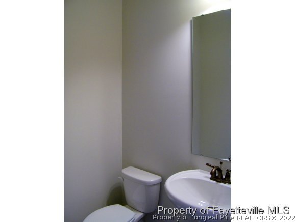 101 Caulfield Road Aberdeen, NC 28315 - Photo 7 of 19 a bathroom with a toilet and a sink