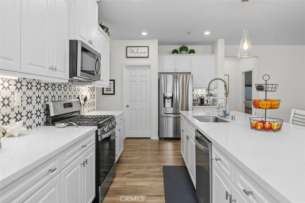 7598 Orangebrook Cove Riverside, CA 92507 - Photo 18 of 45 Kitchen Cooking and Prepping Area with Easy Reach Storage Cabinets and Pantry