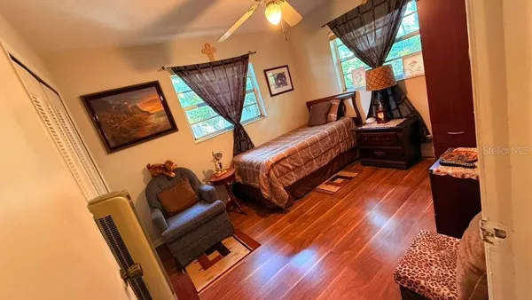 a view of a dining room with furniture and a rug