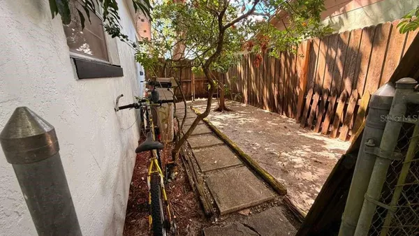 a view of balcony with wooden floor and outdoor seating