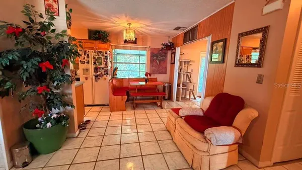 a view of two chairs in a patio