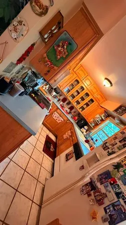 a kitchen with stainless steel appliances a stove a sink and a refrigerator