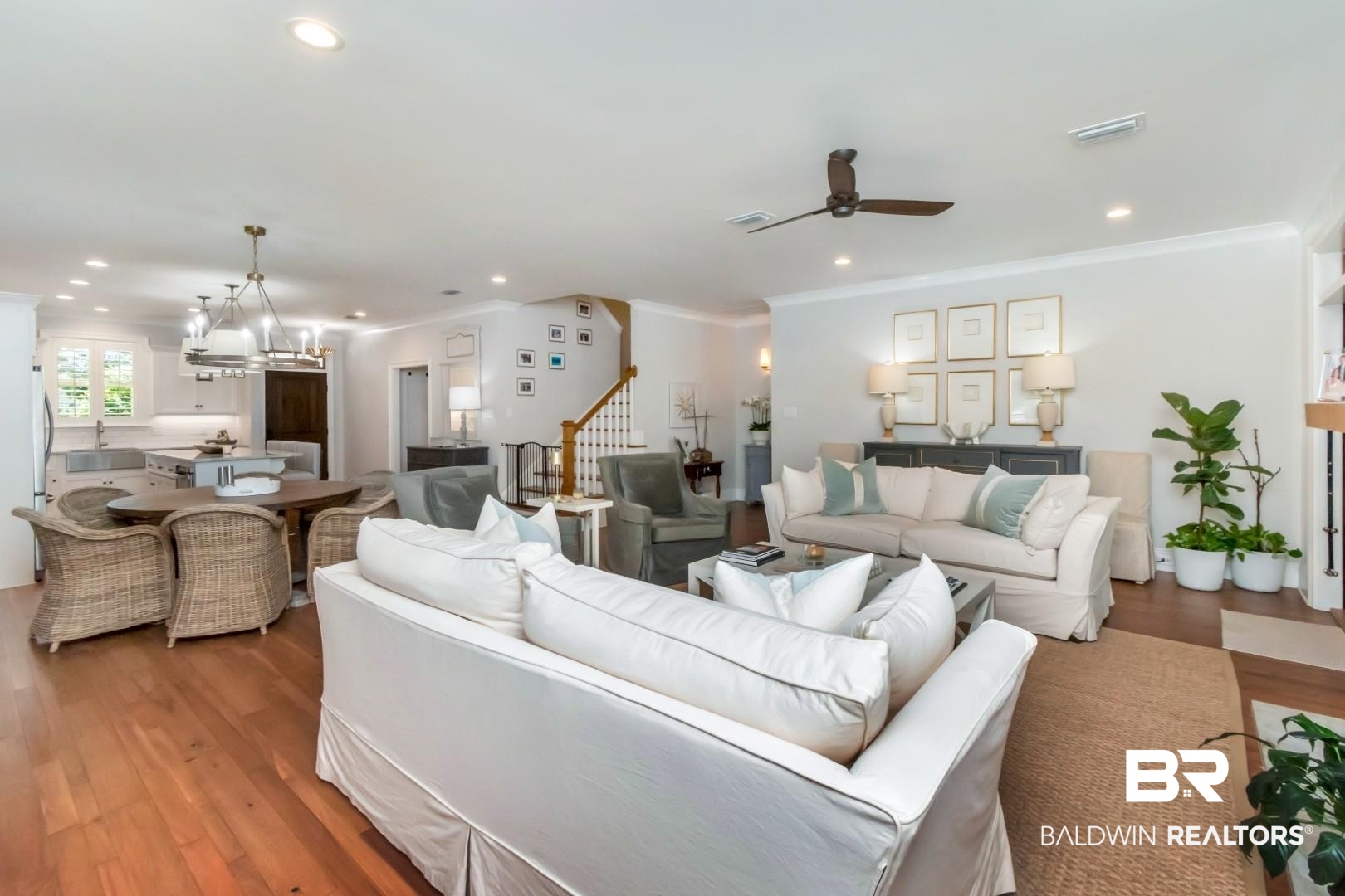 4404 Stein Street Mobile, AL 36608 - Photo 19 of 50 Living room with a chandelier, wood finished floors, stairs, a ceiling fan, and ornamental molding