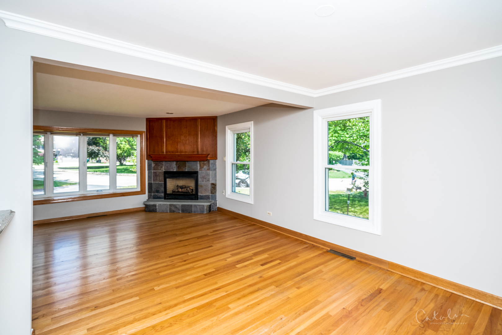1415 Charing Cross Road Deerfield, IL 60015 - Photo 13 of 23 a view of empty room with wooden floor and fireplace