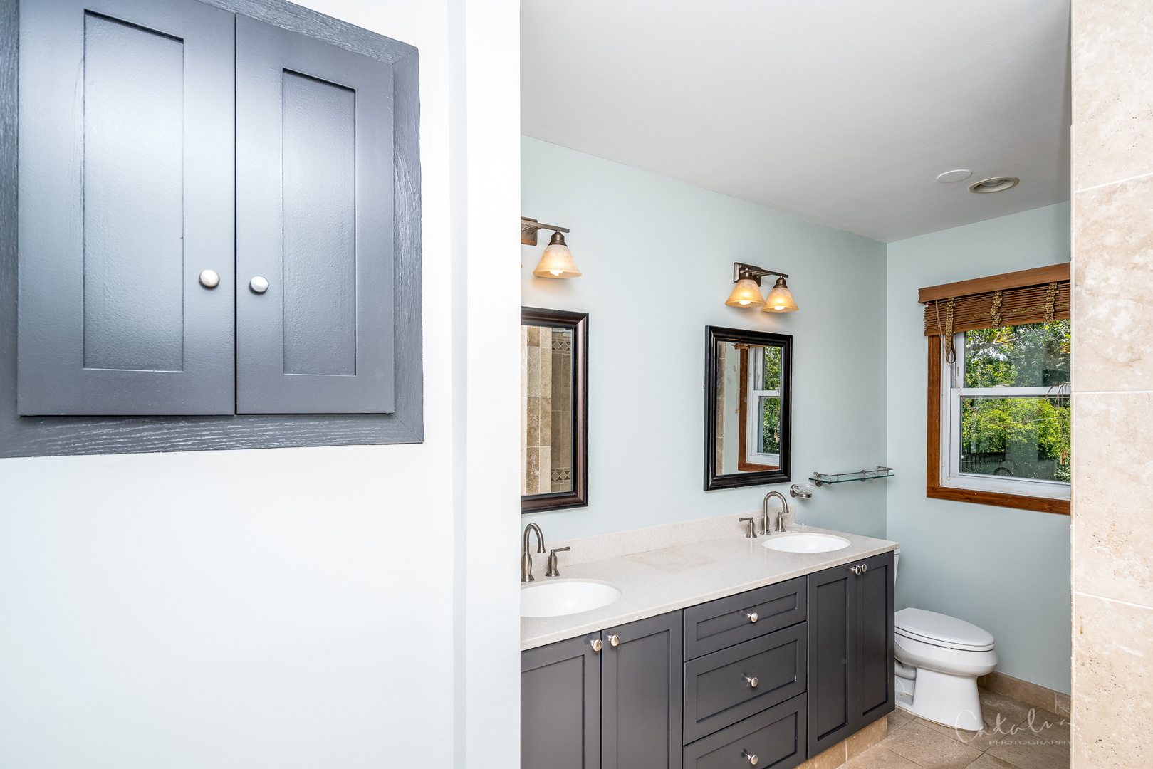 1415 Charing Cross Road Deerfield, IL 60015 - Photo 16 of 23 a bathroom with a toilet a sink and a large mirror