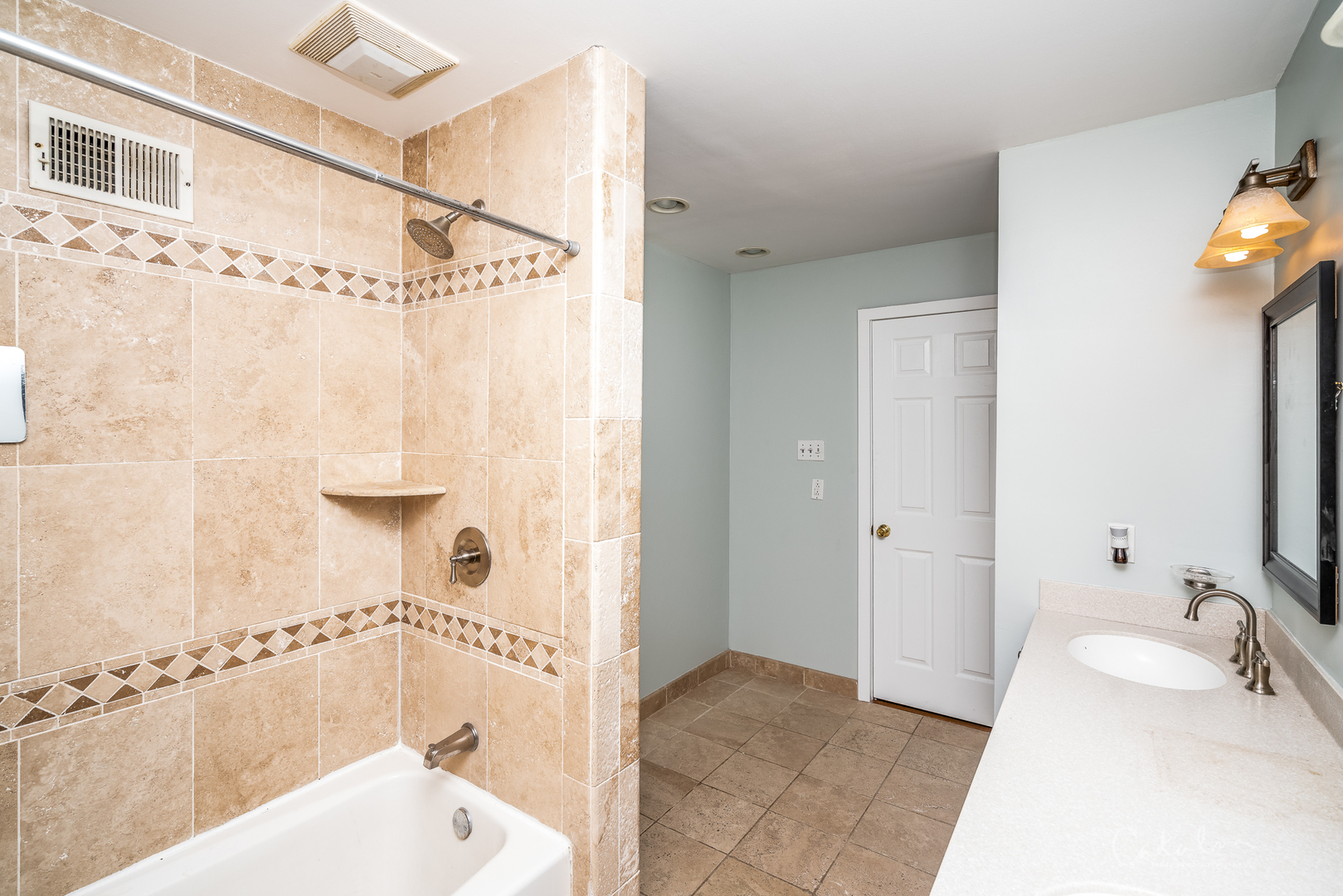 1415 Charing Cross Road Deerfield, IL 60015 - Photo 17 of 23 a bathroom with a tub a sink and a shower