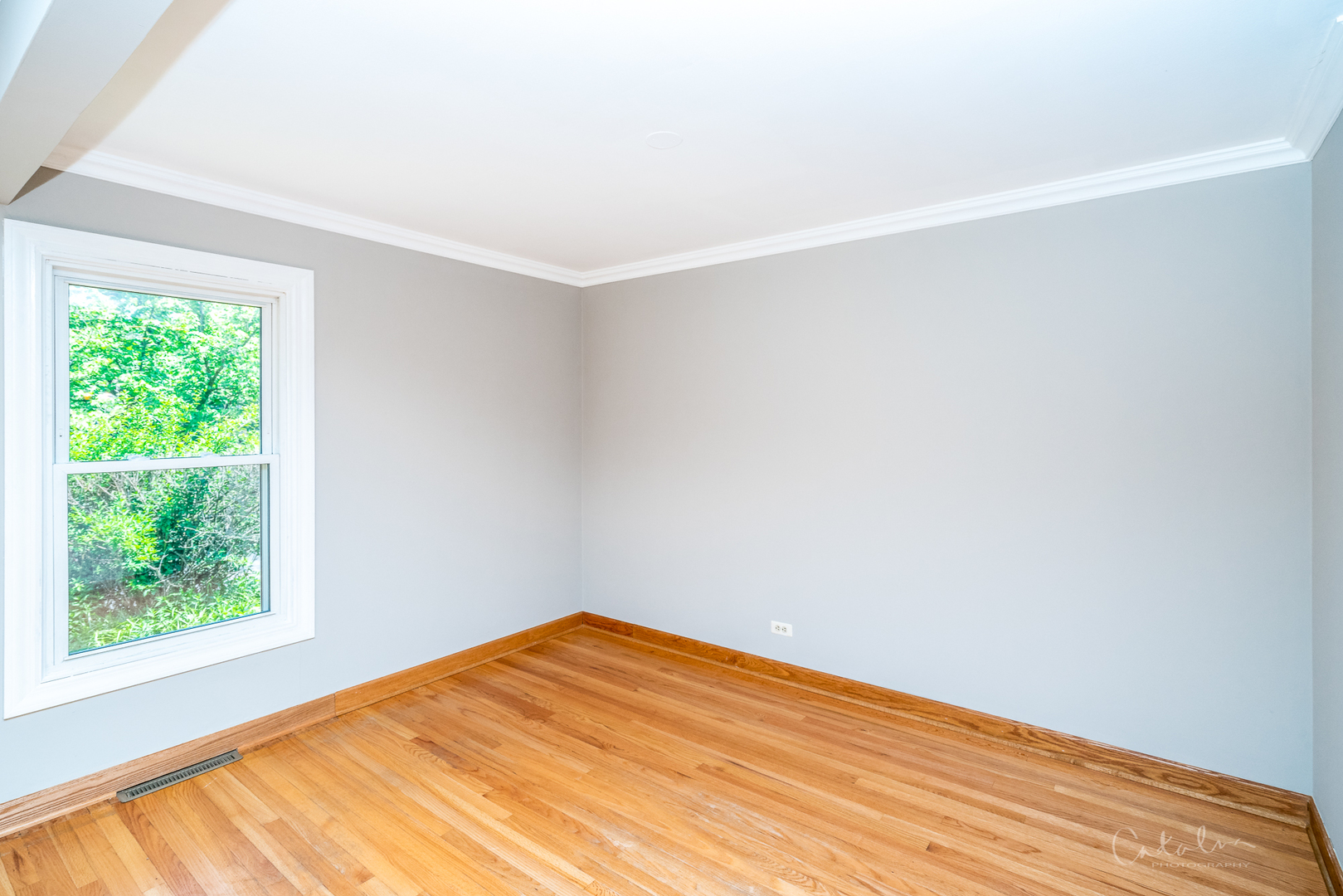 1415 Charing Cross Road Deerfield, IL 60015 - Photo 19 of 23 a view of an empty room with wooden floor and a window