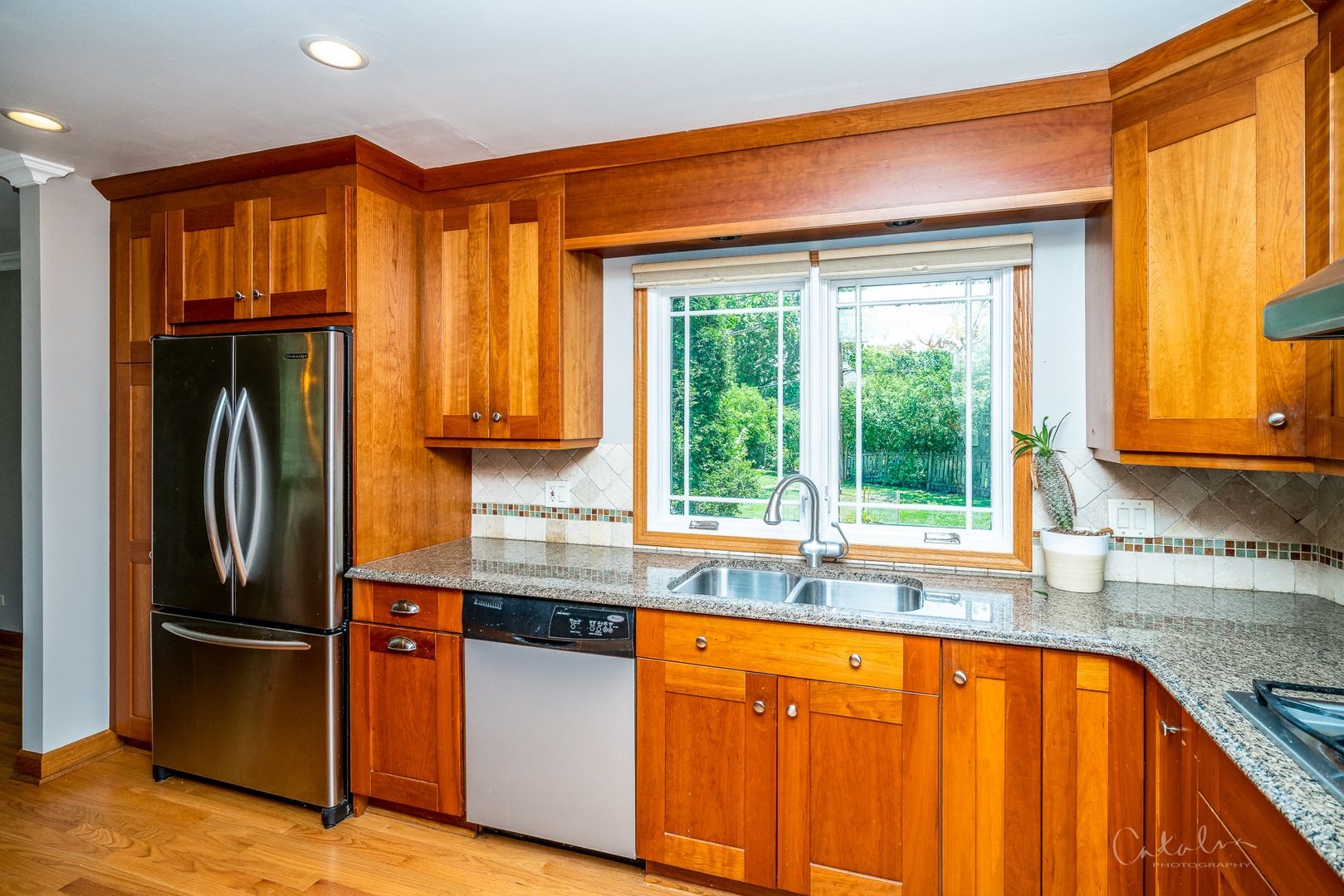 1415 Charing Cross Road Deerfield, IL 60015 - Photo 5 of 23 a kitchen with stainless steel appliances granite countertop a refrigerator and a sink