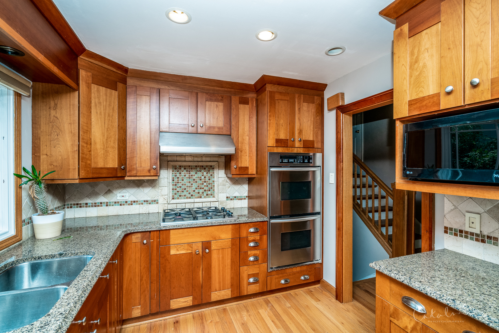 1415 Charing Cross Road Deerfield, IL 60015 - Photo 6 of 23 a kitchen with stainless steel appliances granite countertop a refrigerator and a sink