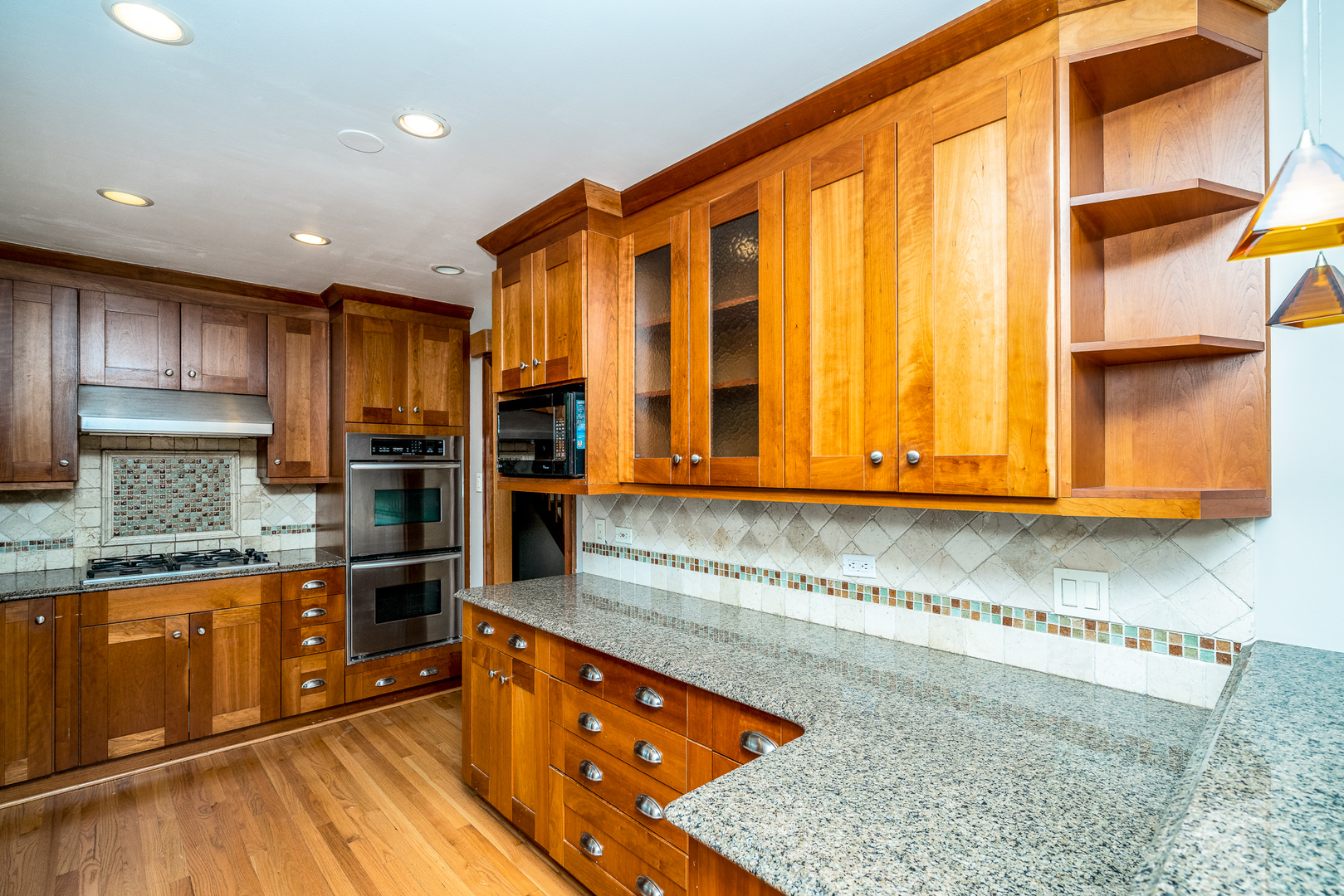 1415 Charing Cross Road Deerfield, IL 60015 - Photo 9 of 23 a kitchen with stainless steel appliances granite countertop a refrigerator and a stove top oven