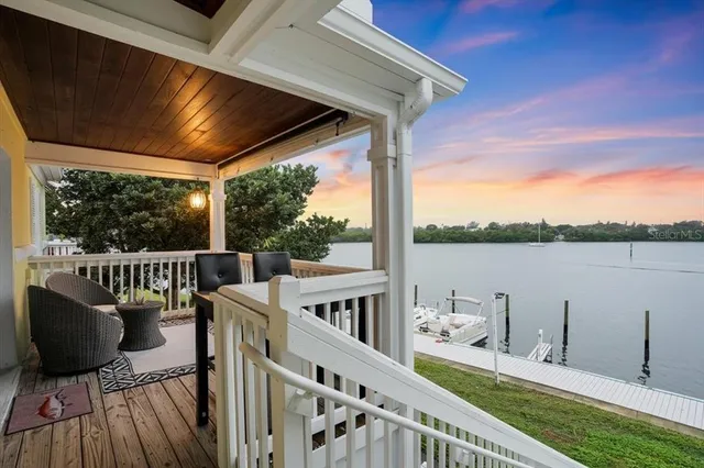 a balcony with wooden floor and outdoor space