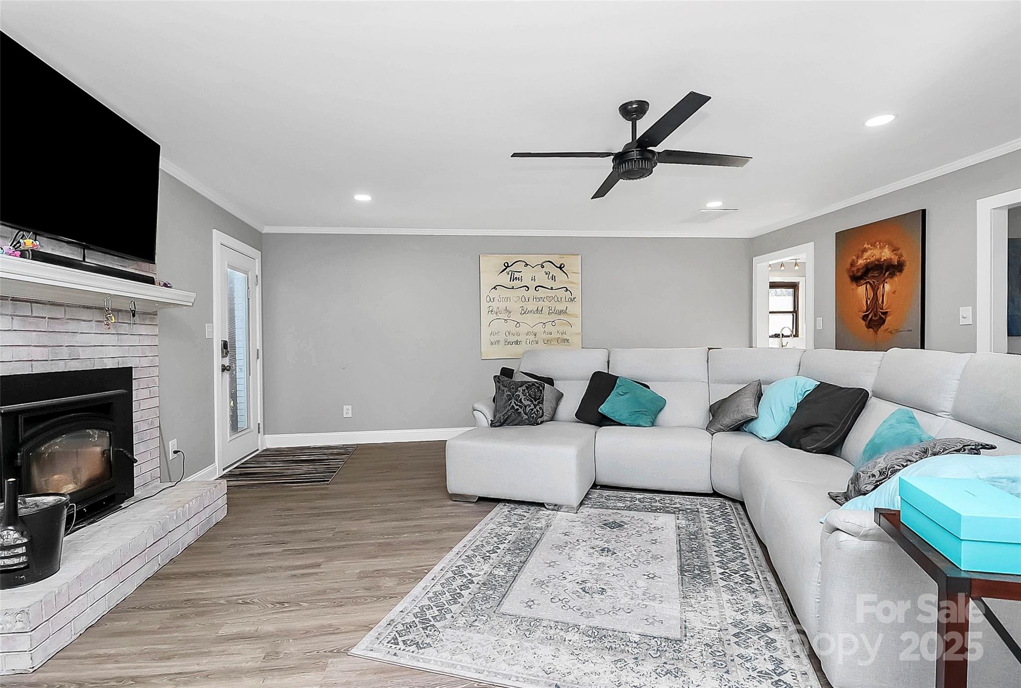 9808 Washam Potts Road Cornelius, NC 28031 - Photo 15 of 43 a living room with furniture fireplace and flat screen tv