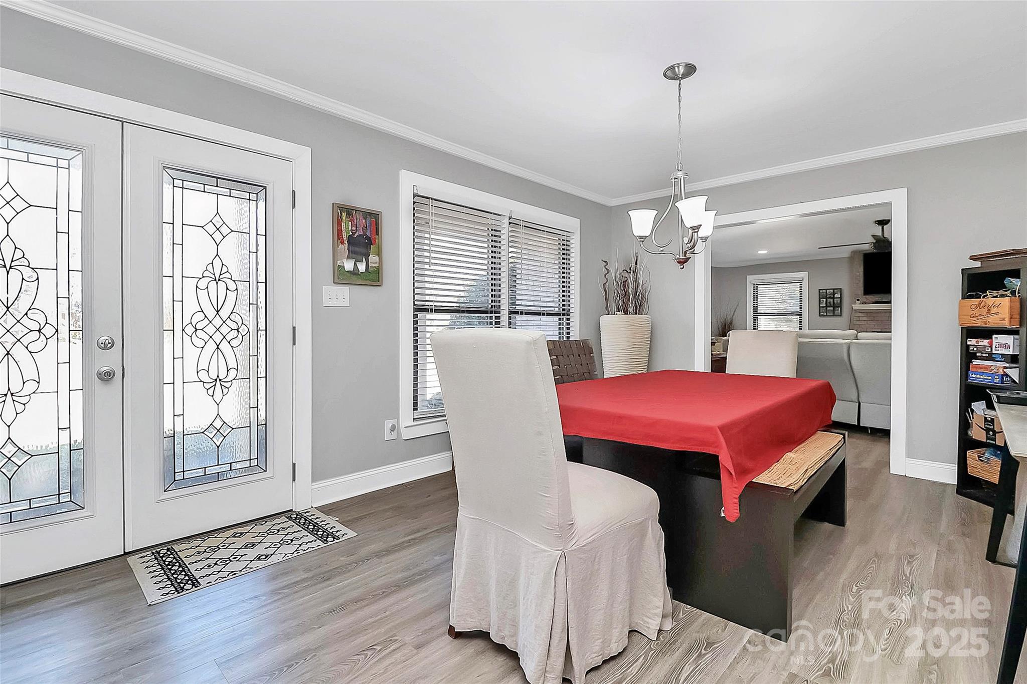 9808 Washam Potts Road Cornelius, NC 28031 - Photo 18 of 43 a view of a dining room with furniture and wooden floor