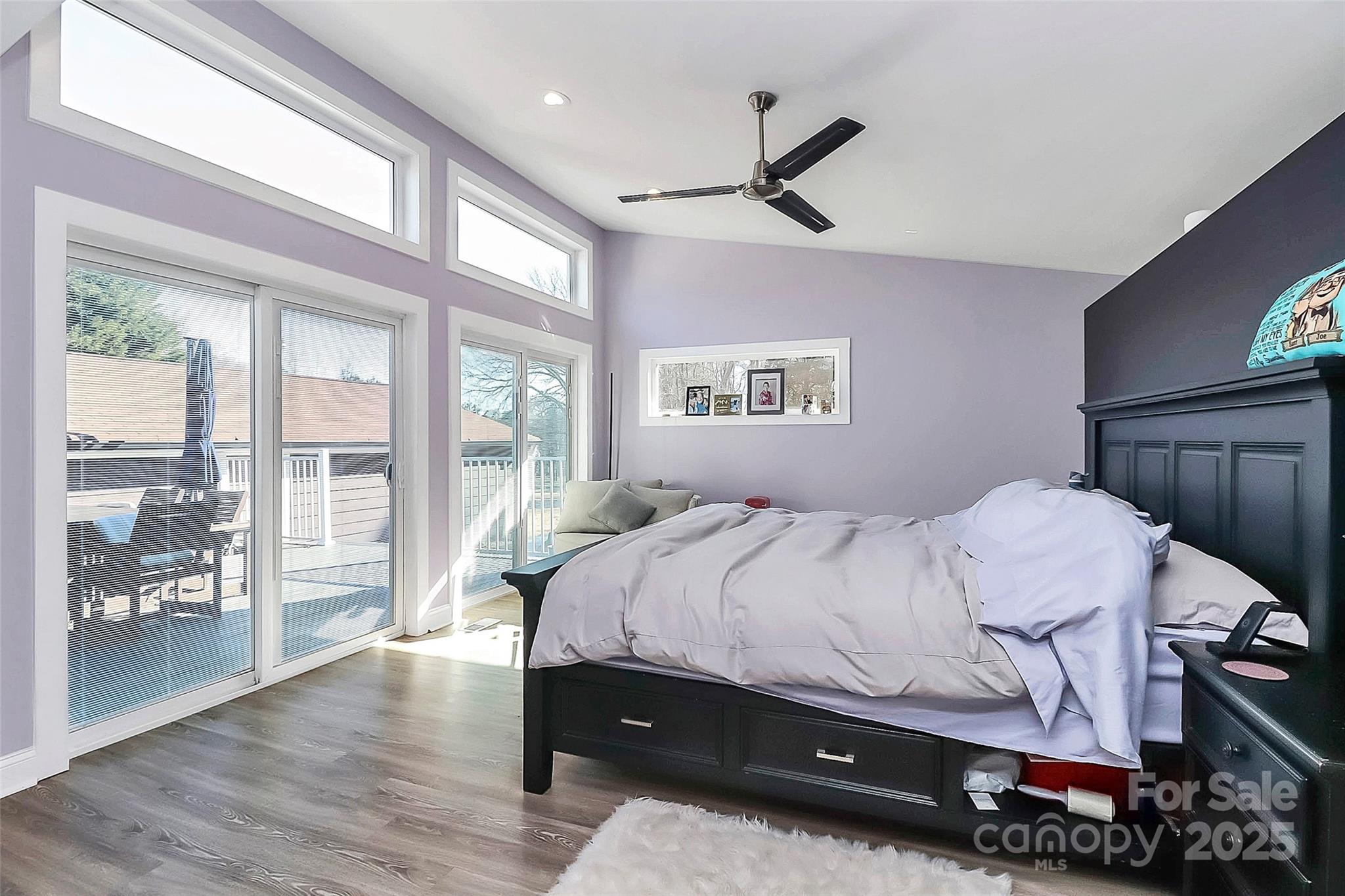 9808 Washam Potts Road Cornelius, NC 28031 - Photo 19 of 43 a bedroom with a bed and window