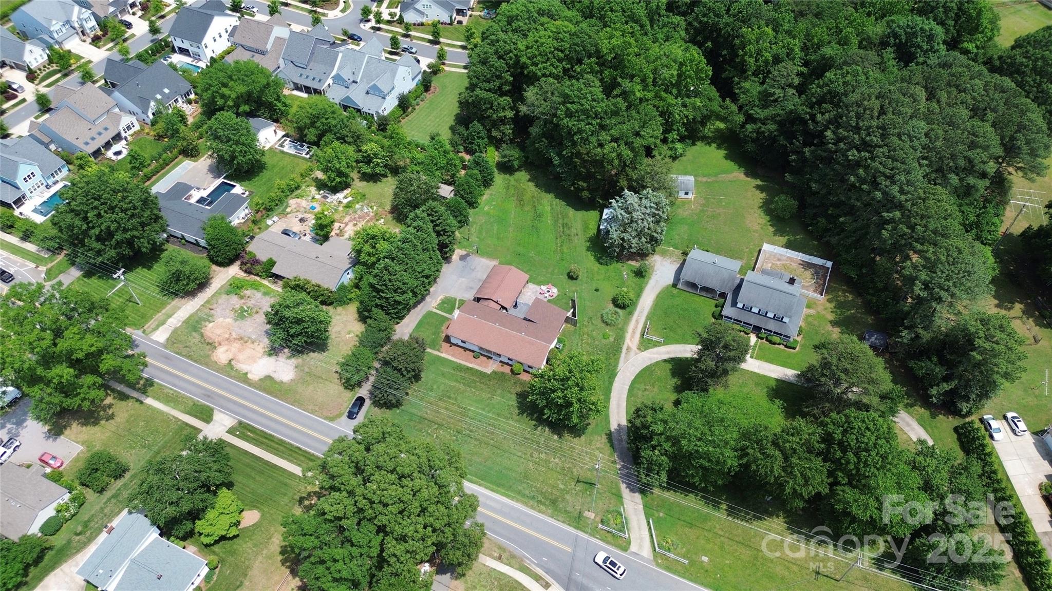 9808 Washam Potts Road Cornelius, NC 28031 - Photo 30 of 43 an aerial view of residential house with outdoor space and trees all around