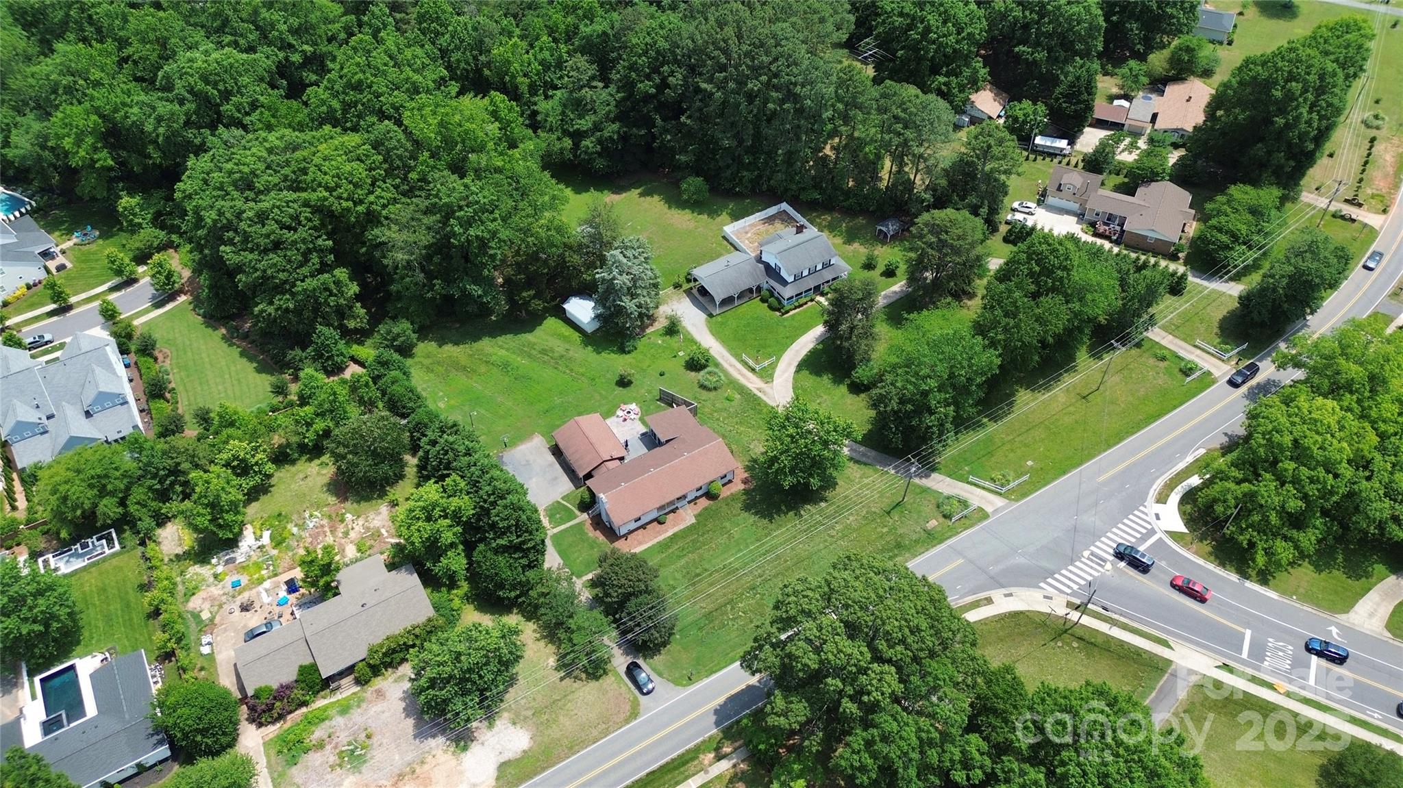9808 Washam Potts Road Cornelius, NC 28031 - Photo 31 of 43 an aerial view of a house with a yard