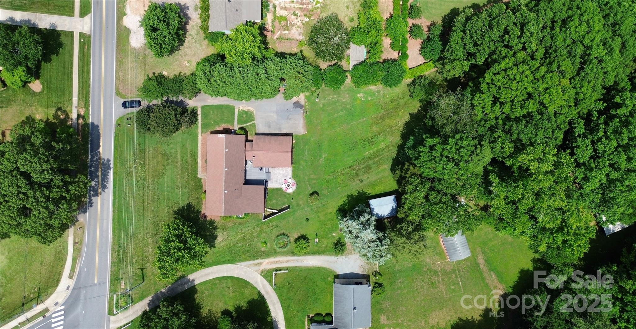9808 Washam Potts Road Cornelius, NC 28031 - Photo 32 of 43 an aerial view of a house with a yard