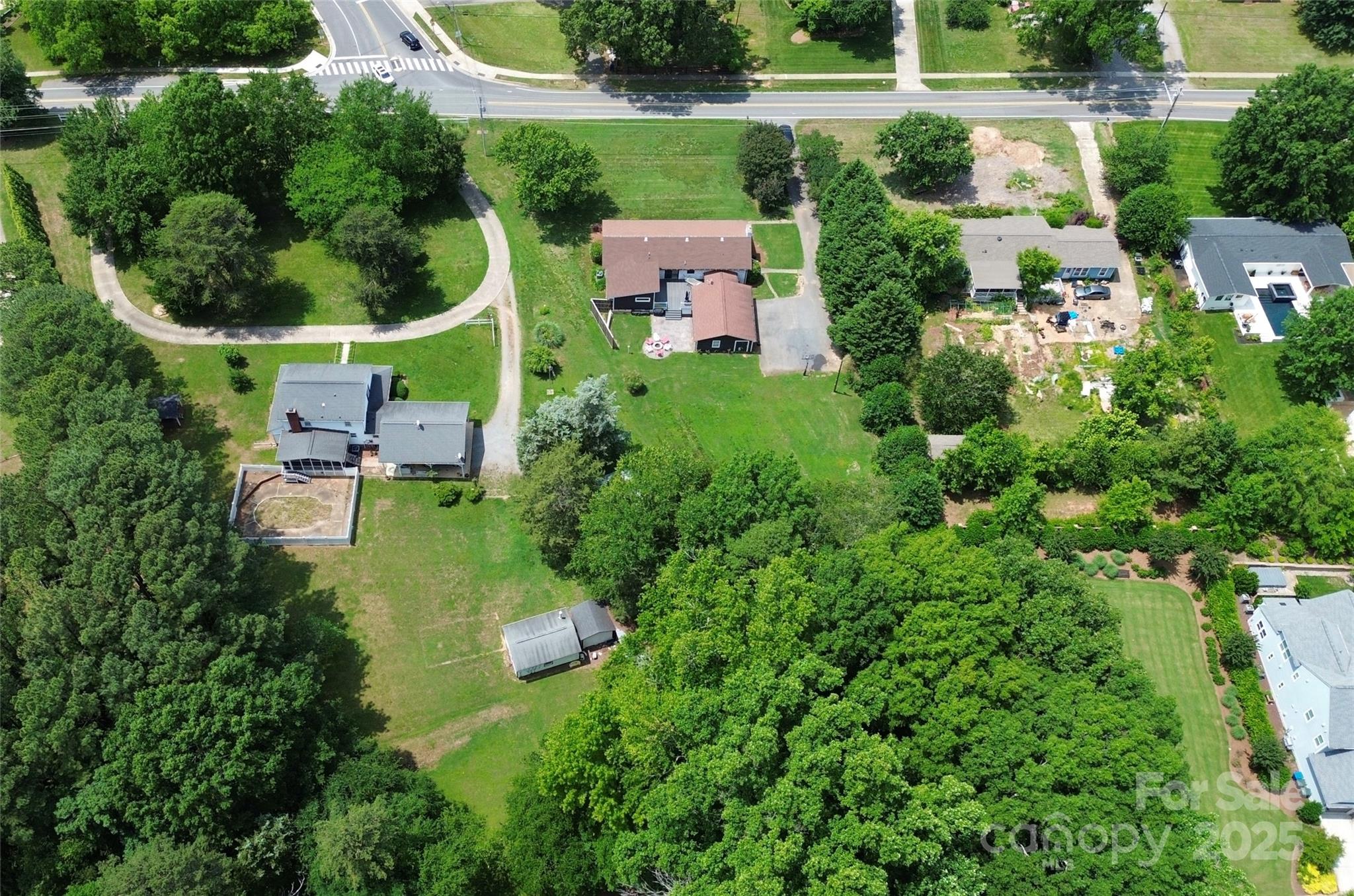 9808 Washam Potts Road Cornelius, NC 28031 - Photo 33 of 43 an aerial view of residential house with outdoor space and trees all around