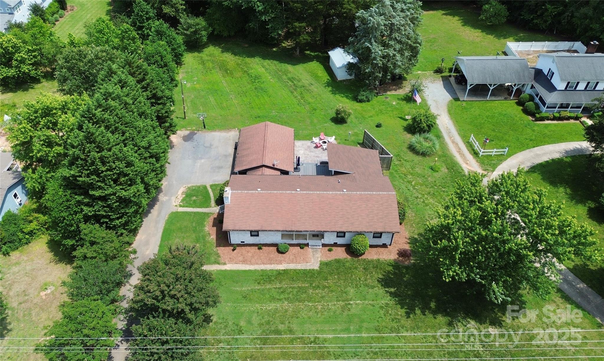 9808 Washam Potts Road Cornelius, NC 28031 - Photo 4 of 43 an aerial view of a house with pool yard and outdoor seating