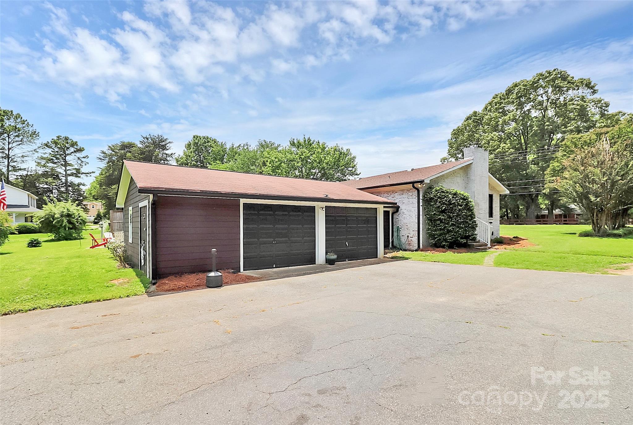 9808 Washam Potts Road Cornelius, NC 28031 - Photo 41 of 43 a front view of a house with a yard and garage