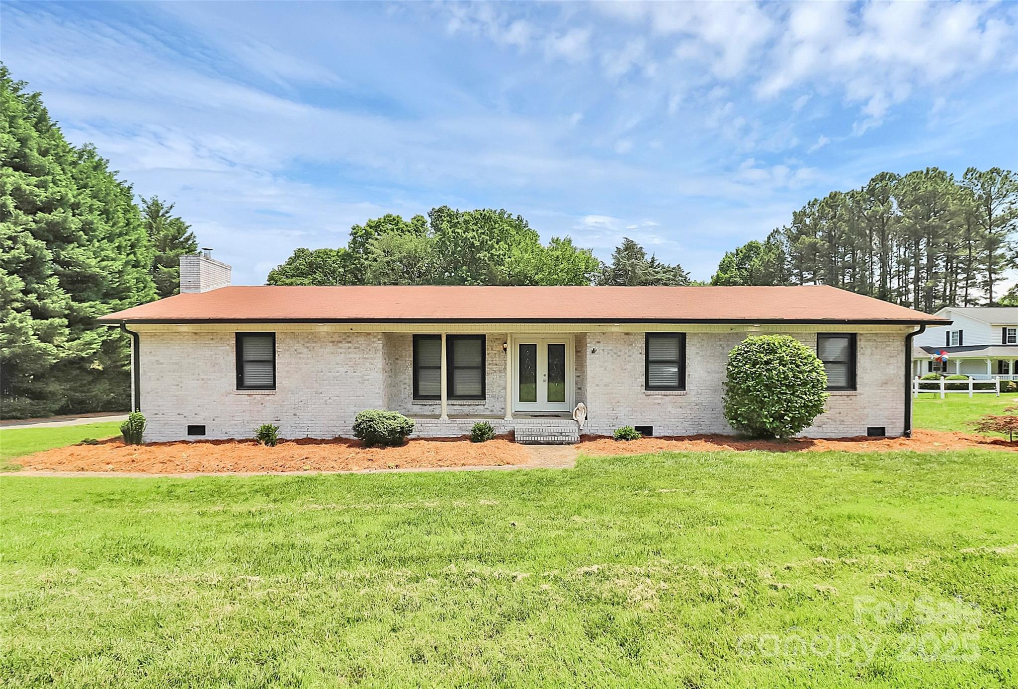 9808 Washam Potts Road Cornelius, NC 28031 - Photo 43 of 43 a front view of house with yard and green space