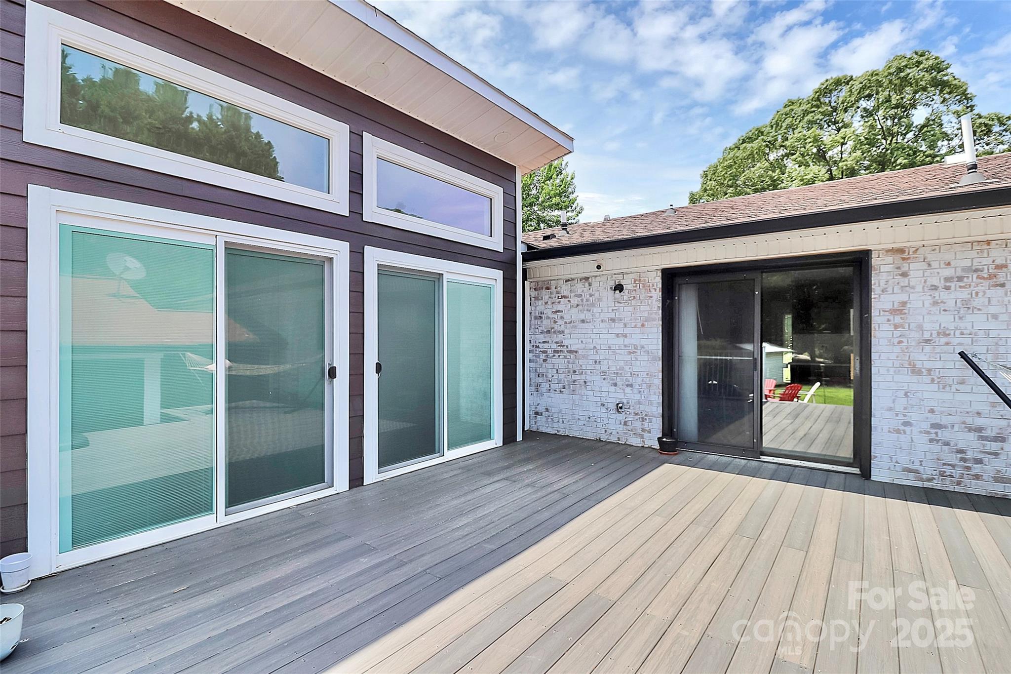 9808 Washam Potts Road Cornelius, NC 28031 - Photo 7 of 43 a view of a two room with wooden floor and outer view