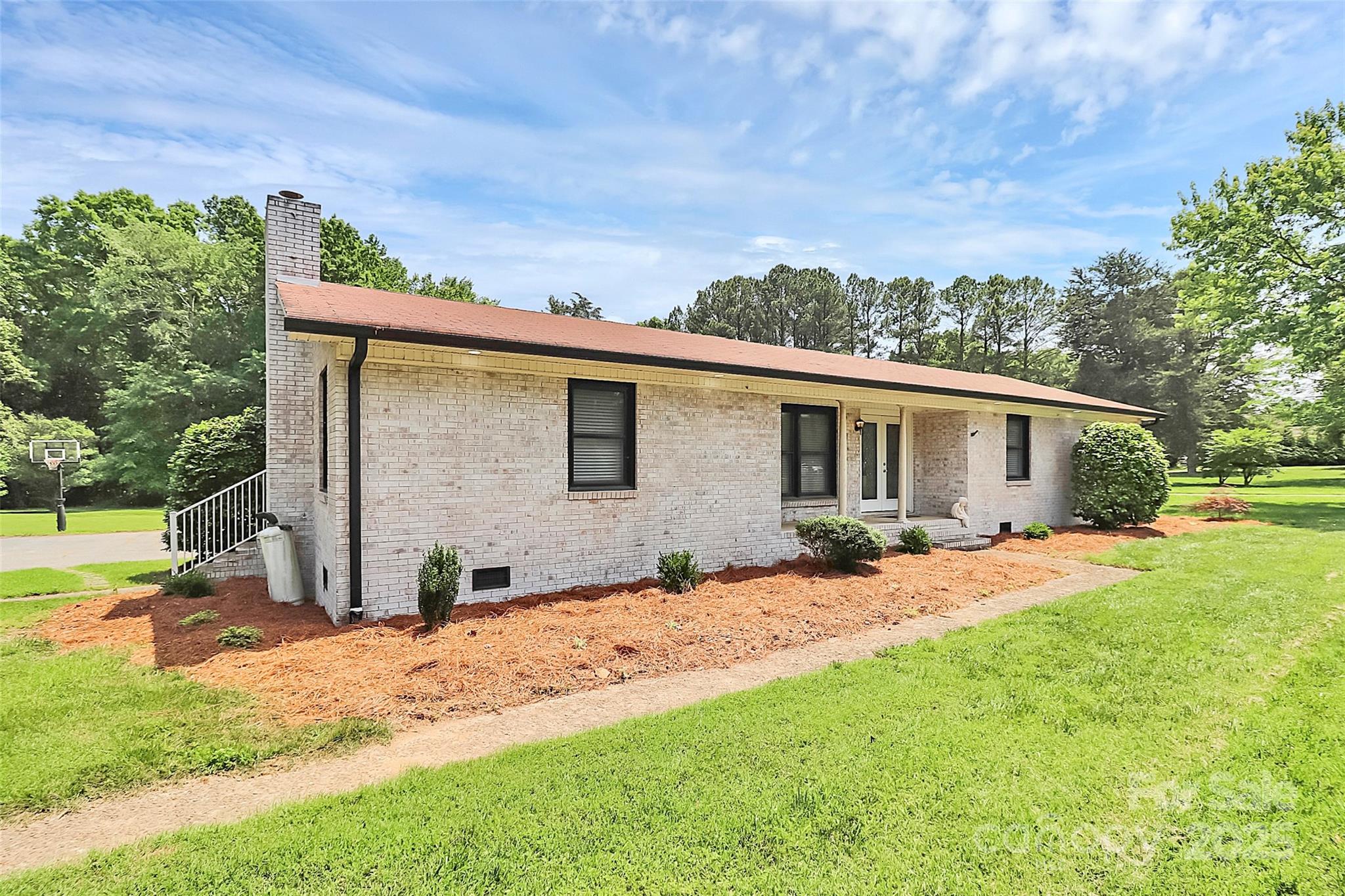 9808 Washam Potts Road Cornelius, NC 28031 - Photo 9 of 43 a view of a house with yard and sitting area