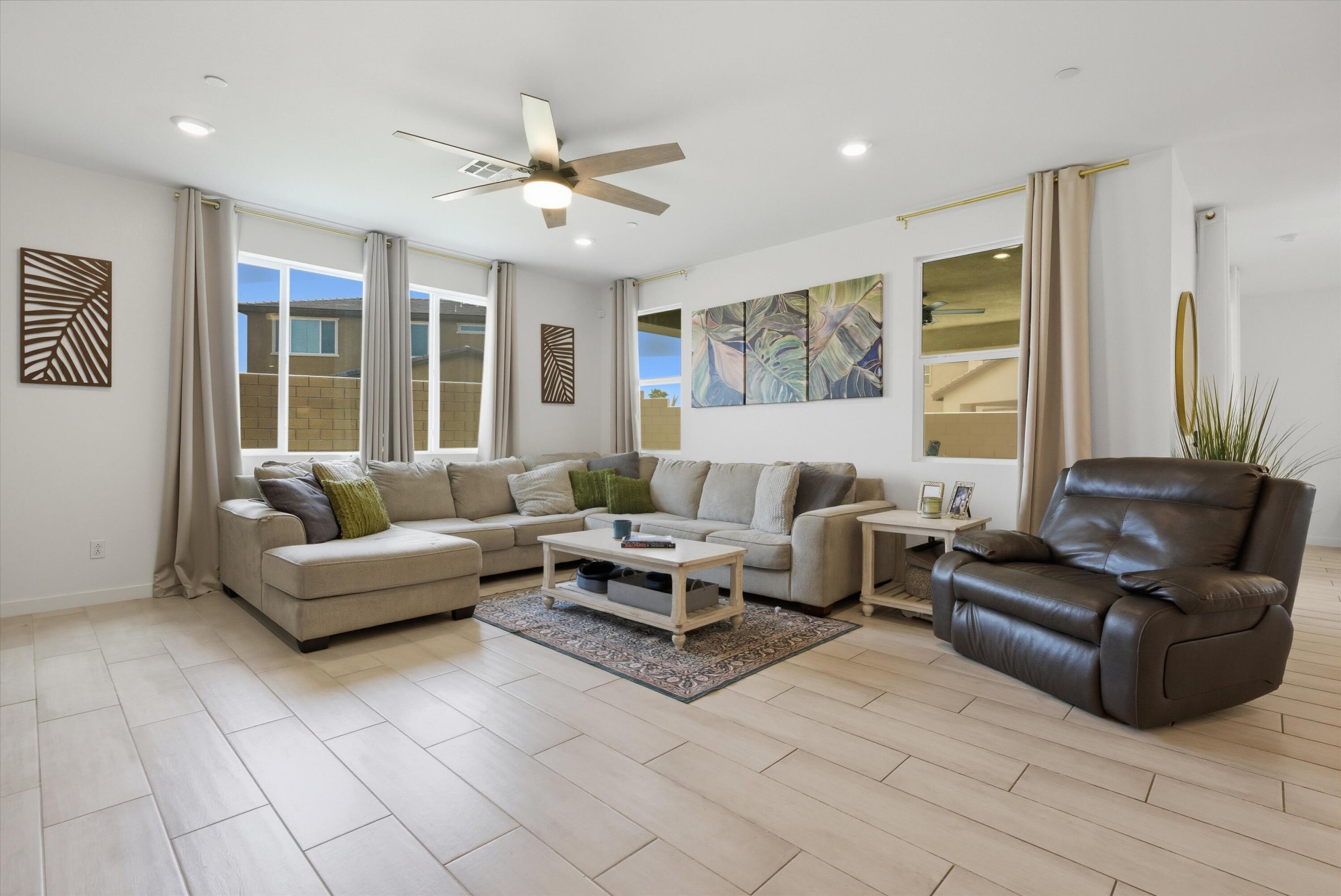 40340 Vivaldi Court Indio, CA 92203 - Photo 14 of 30 a living room with furniture and large windows